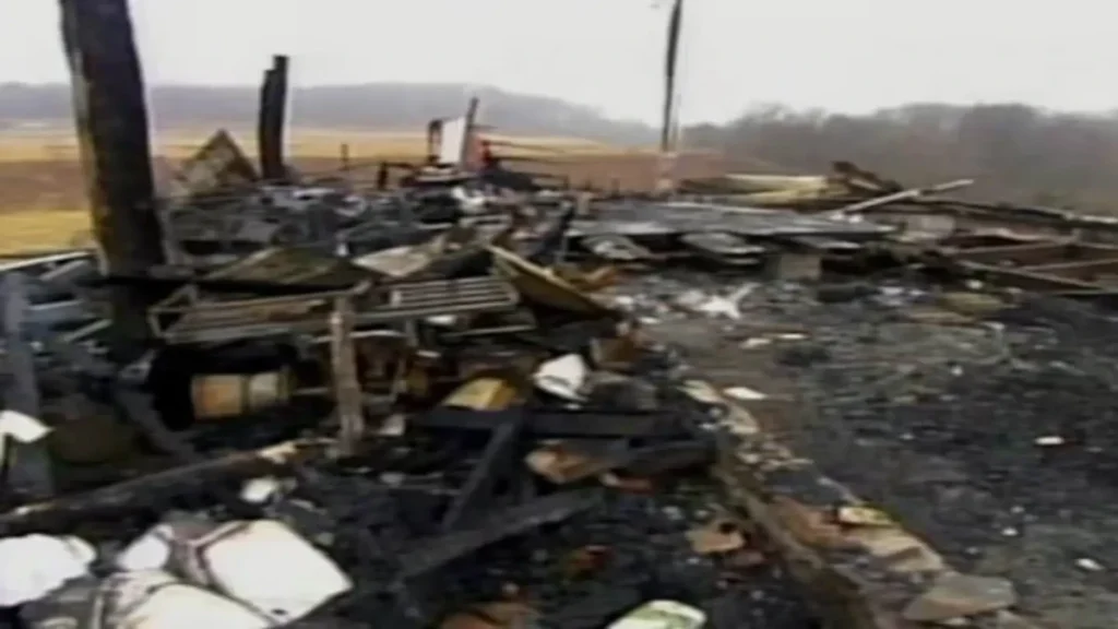 The Freeman's burnt out trailer home the morning after the murders, when no trace of the girls could be found