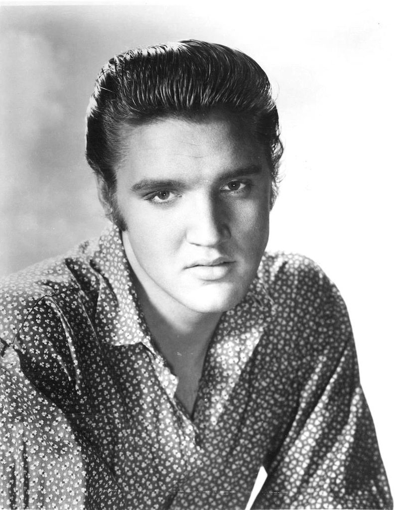 Elvis Presley in a black-and-white promotional portrait for the 1956 film Love Me Tender.