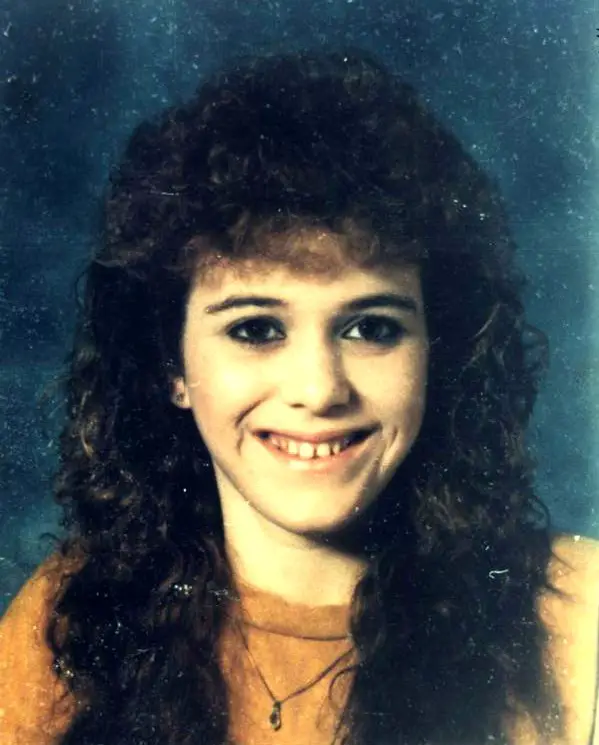 Portrait of Regina Kay Walters smiling with long curly dark hair before her disappearance in 1990.
