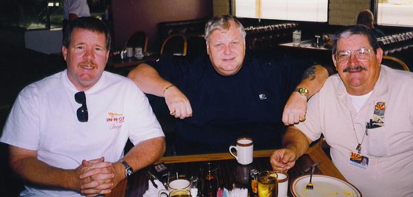 Three investigators associated with the Robert Ben Rhoades case seated together at a restaurant.